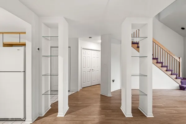 a view of entryway with wooden floor and stair