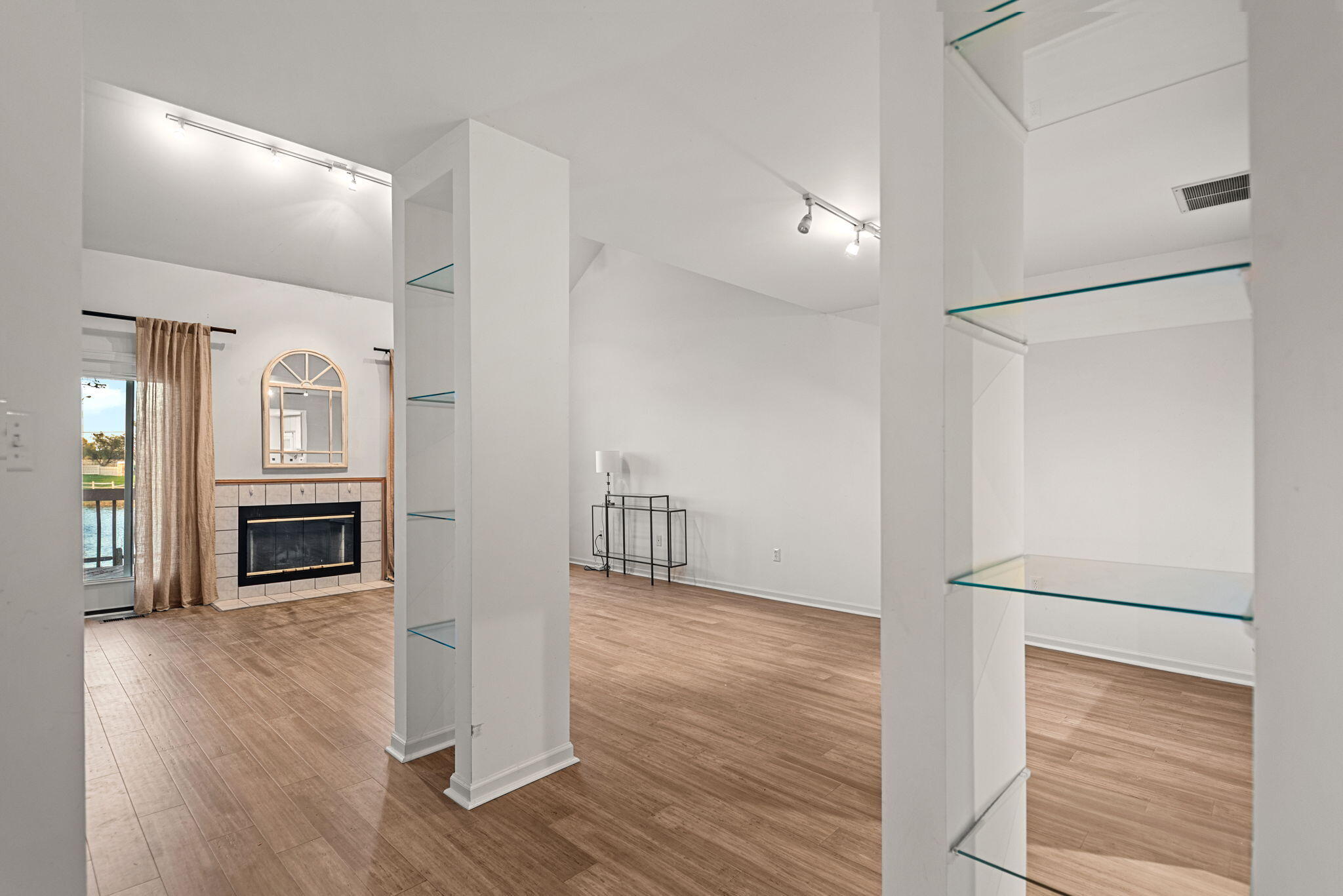 1345 West 94th Court Crown Point, IN 46307 - Photo 7 of 20 a view of a livingroom with wooden floor kitchen and an entryway