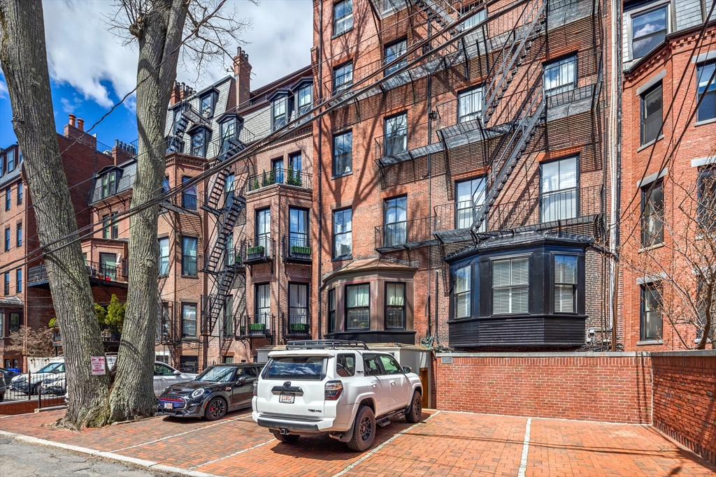 357-359 Beacon Street, Unit 2 Boston, MA 02116 - Photo 17 of 18 a car parked on the side of a street