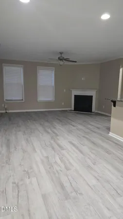 a kitchen with granite countertop a sink a stove and cabinets