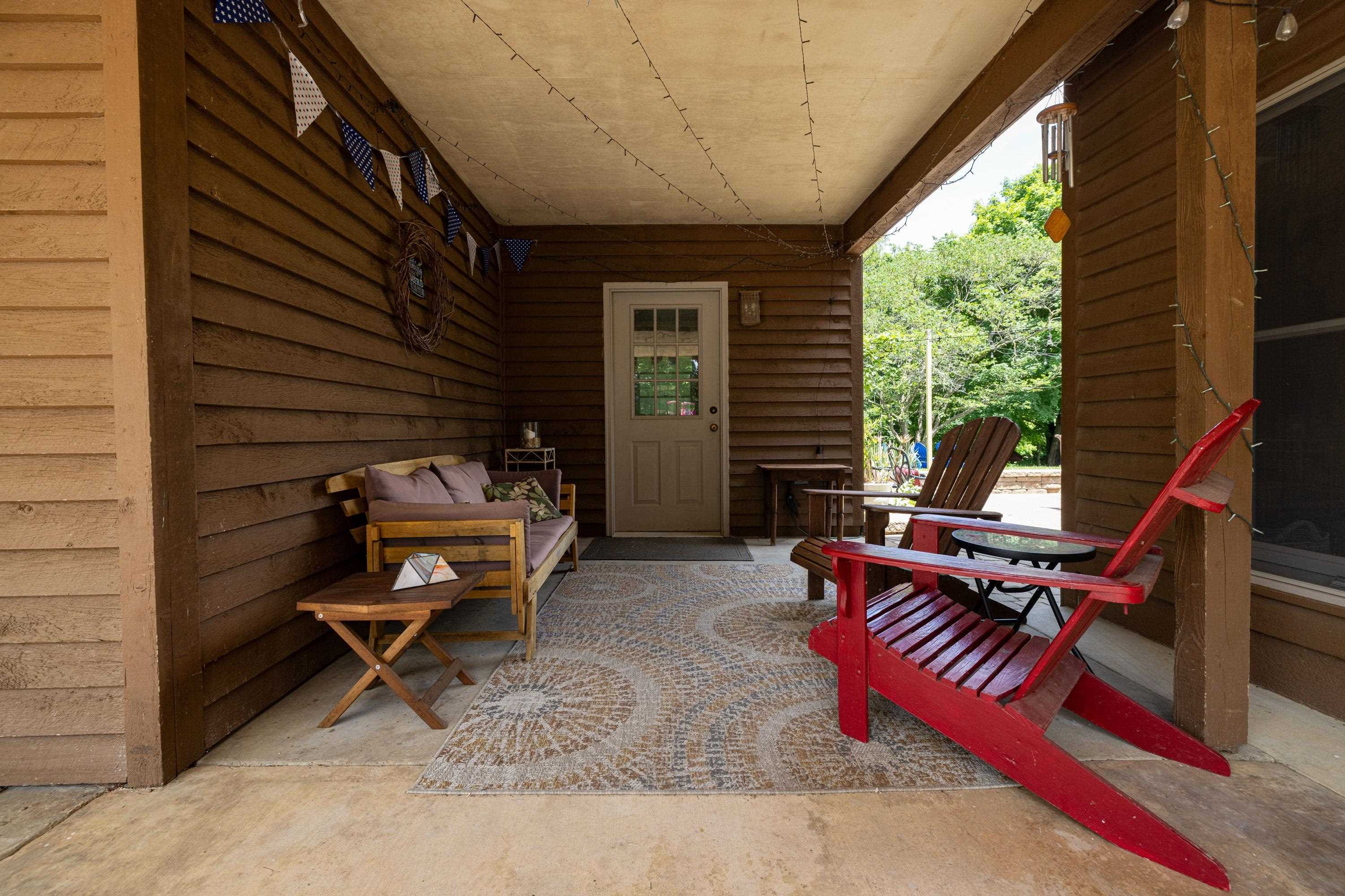 3980 Greenmount Road Harrisonburg, VA 22802 - Photo 50 of 75 The covered porch space features room for seating and a covered area to be outside.