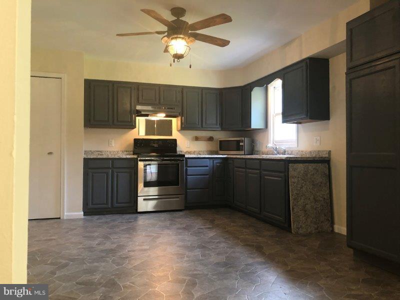 121 Kirks Mill Road Nottingham, PA 19362 - Photo 12 of 39 Eat-in kitchen with pantry closet.