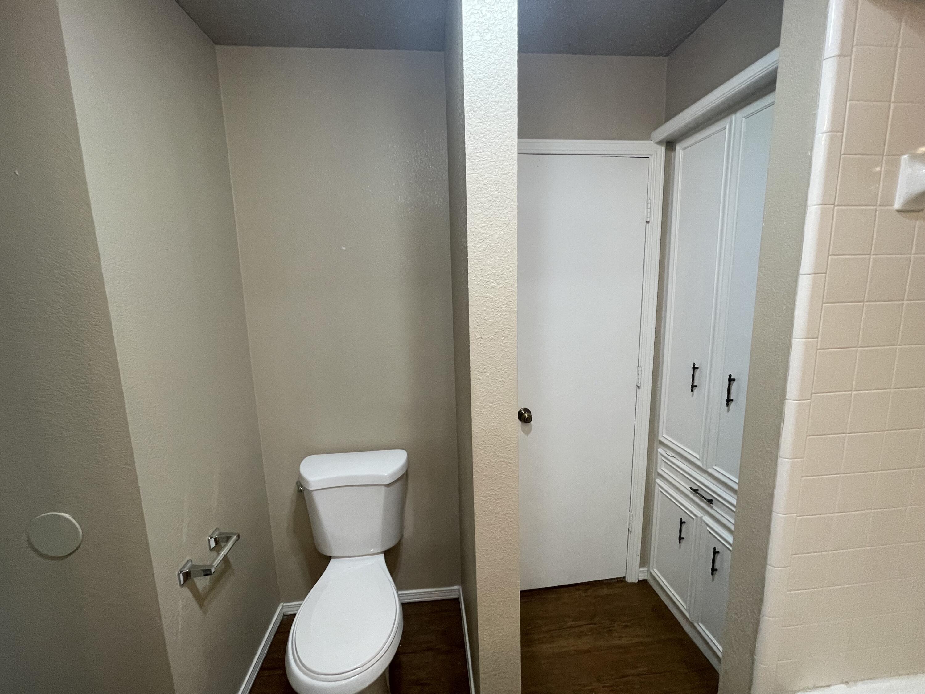 4413 75th Drive, Unit B Lubbock, TX 79424 - Photo 6 of 9 a bathroom with a toilet a sink and a shower