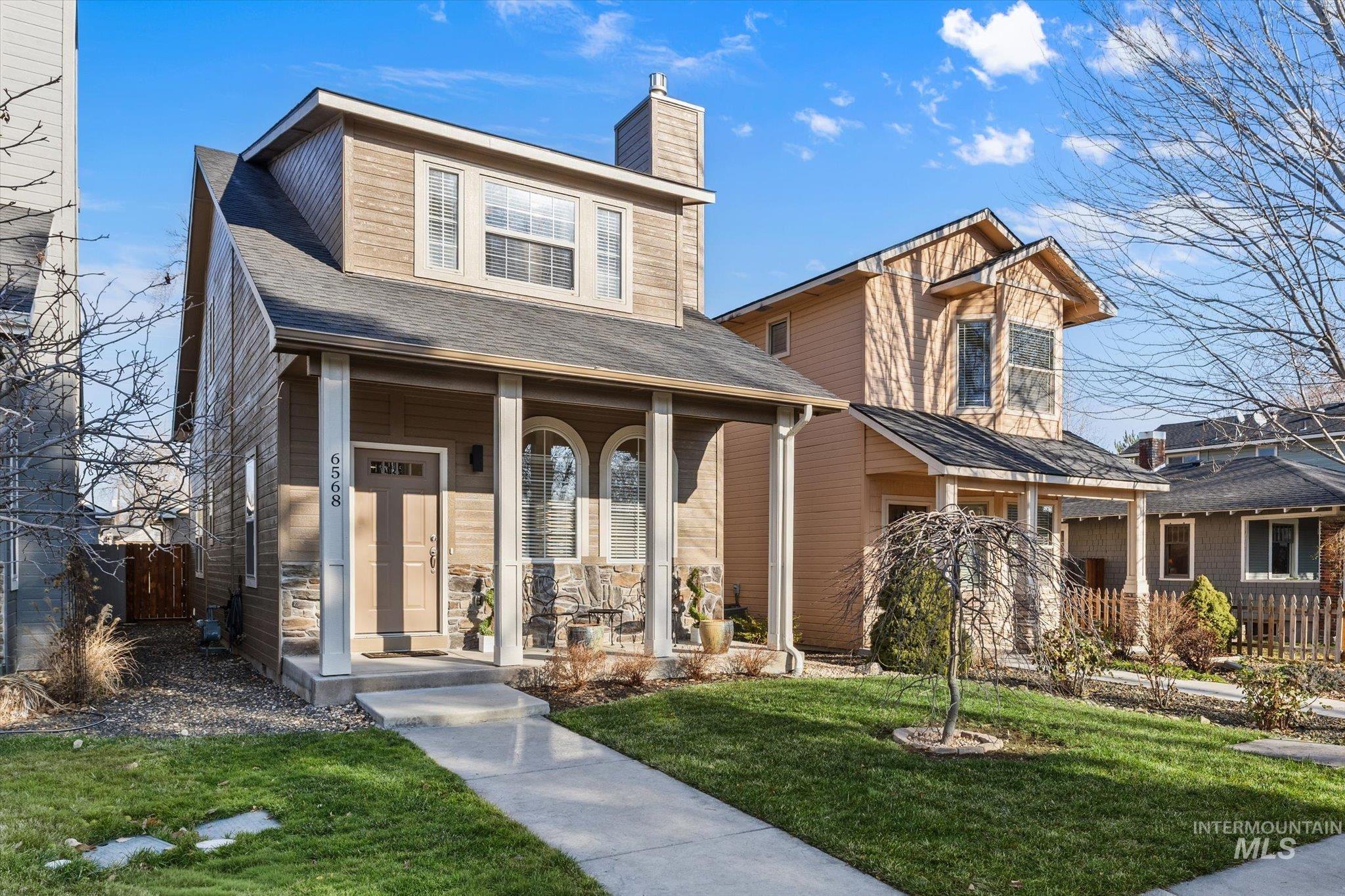 6568 Poplar Street Boise, ID 83704 - Photo 1 of 1 View of front of home with a porch, a shingled roof, and a chimney