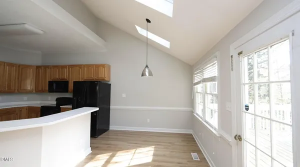 a kitchen with stainless steel appliances a refrigerator a sink a stove a microwave and cabinets