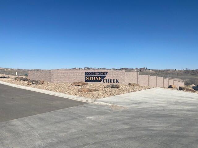 6200 West Country Club Road Canyon, TX 79015 - Photo 1 of 13 Cool Creek entrance and masonry fence do