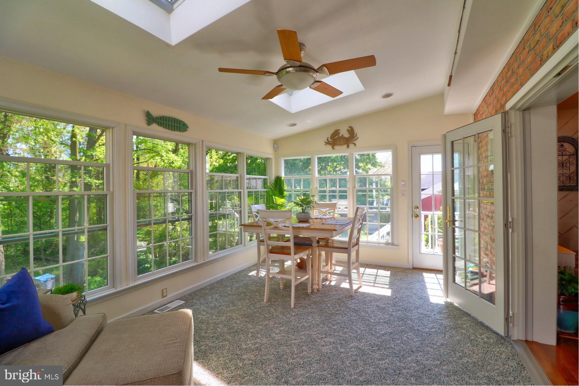 4701 Vicky Road Baltimore, MD 21236 - Photo 18 of 39 a dining room with furniture water view and a floor to ceiling window