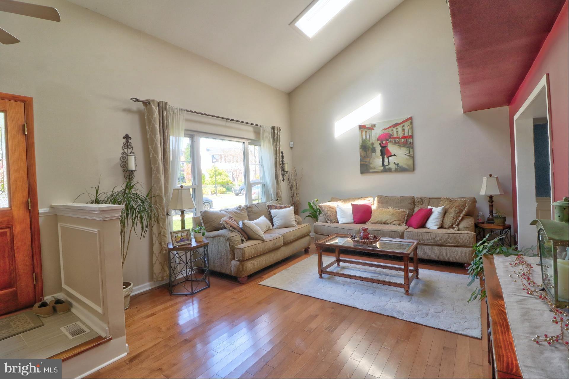 4701 Vicky Road Baltimore, MD 21236 - Photo 21 of 39 a living room with furniture and a flat screen tv