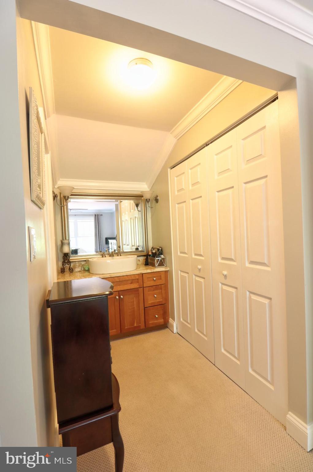 4701 Vicky Road Baltimore, MD 21236 - Photo 27 of 39 a room with kitchen island granite countertop wooden cabinets and stainless steel appliances