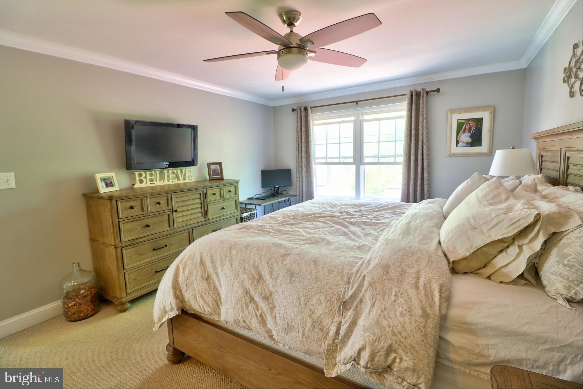 4701 Vicky Road Baltimore, MD 21236 - Photo 28 of 39 a bedroom with a bed and a flat screen tv