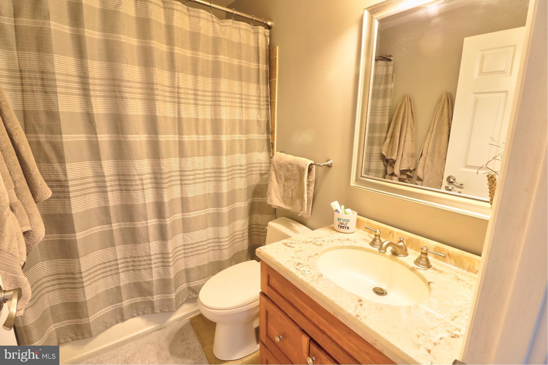 4701 Vicky Road Baltimore, MD 21236 - Photo 31 of 39 a bathroom with a sink toilet and shower