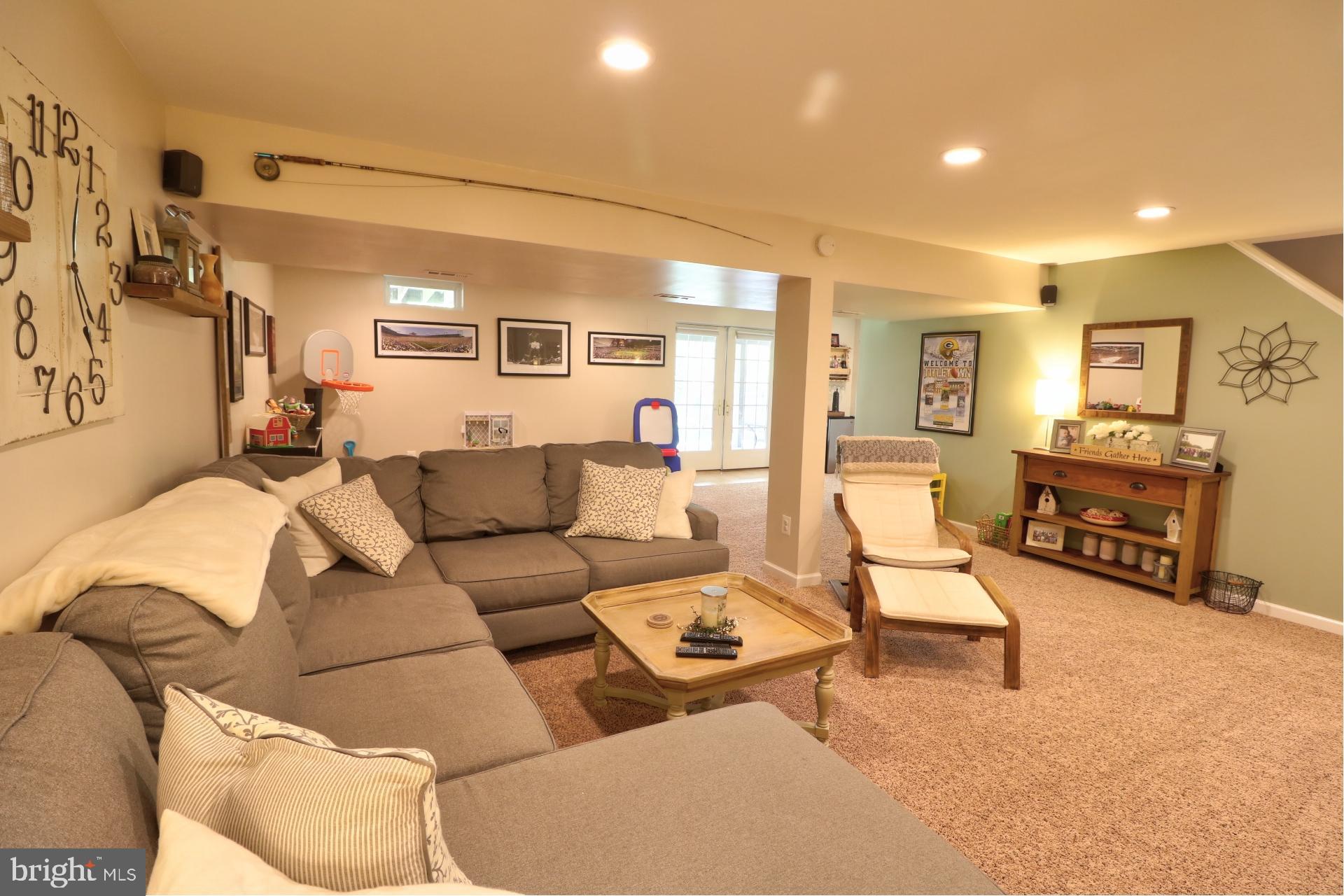 4701 Vicky Road Baltimore, MD 21236 - Photo 33 of 39 a living room with furniture and a flat screen tv