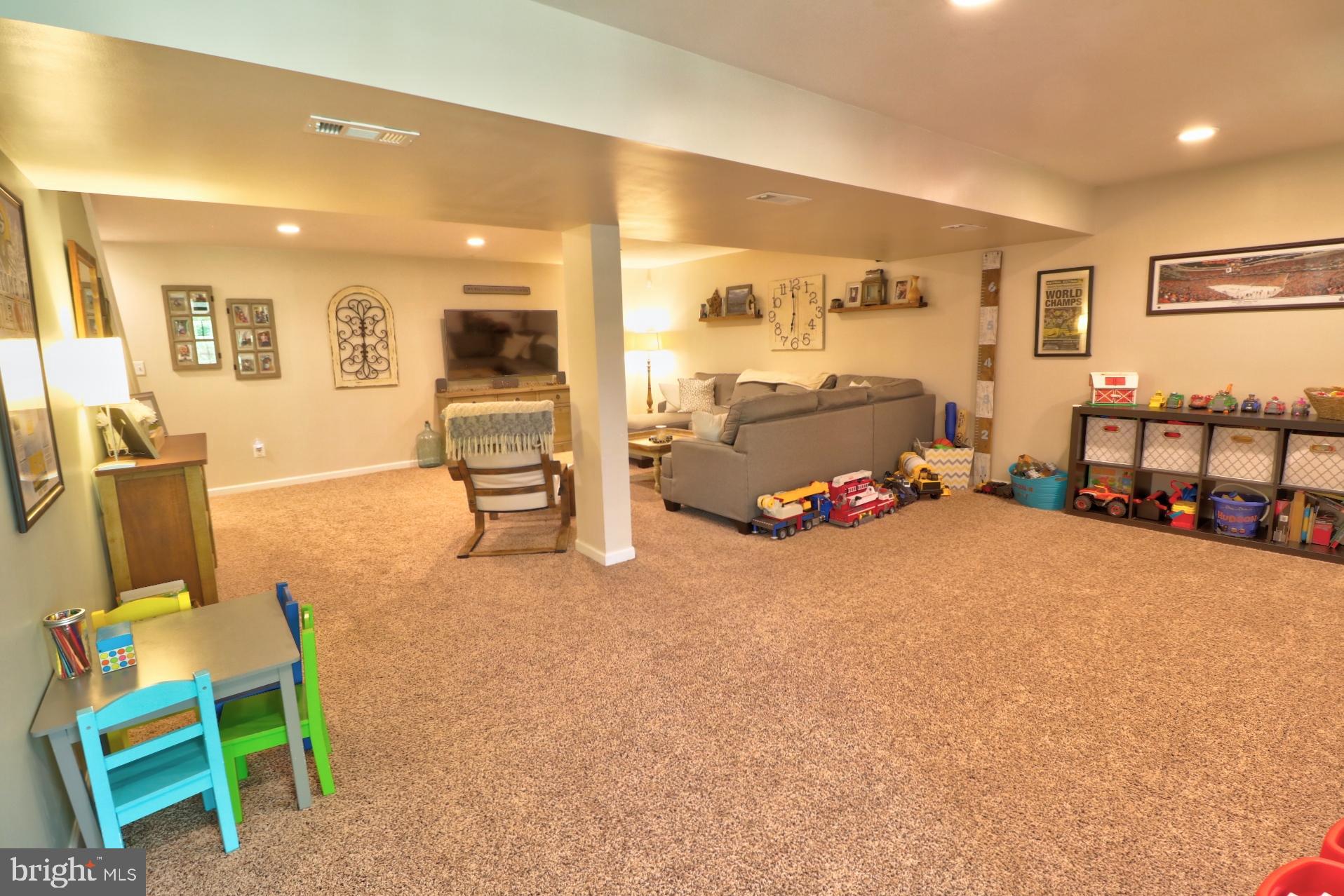 4701 Vicky Road Baltimore, MD 21236 - Photo 34 of 39 a living room with furniture and a flat screen tv