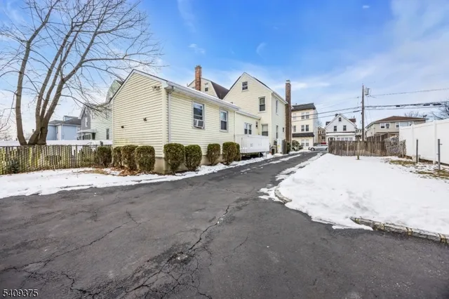 a view of a house with a road