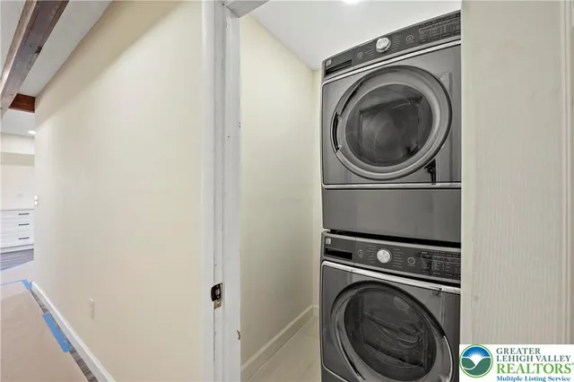a view of a hallway with washer and dryer