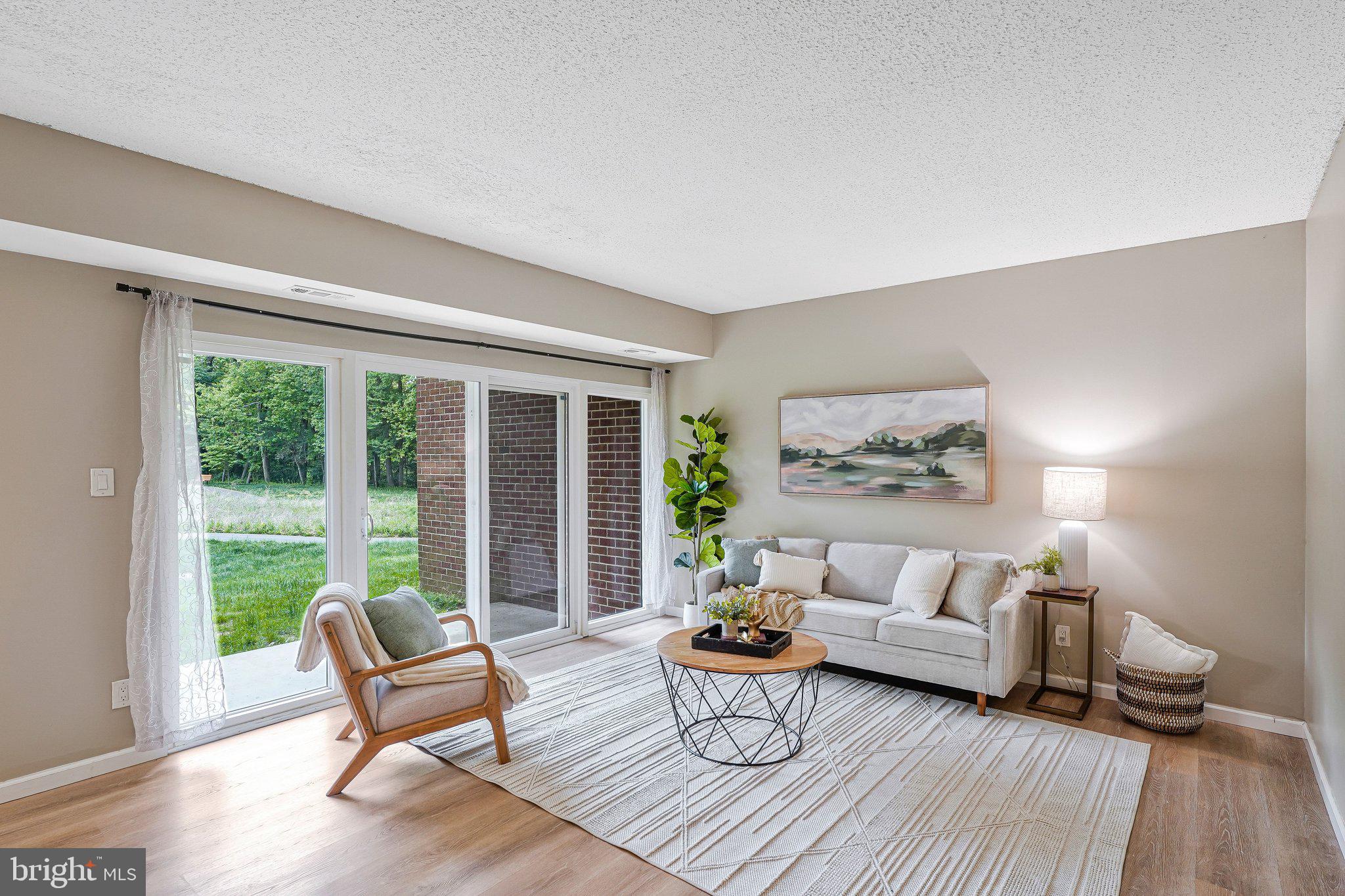 11804 Breton Court, Unit 1A Reston, VA 20191 - Photo 2 of 19 Light-Filled Living Room