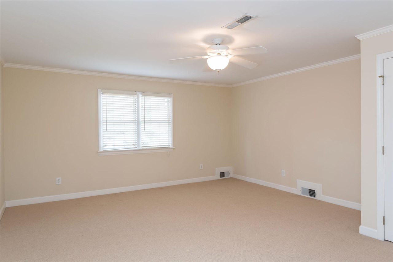 1409 Hathaway Road Raleigh, NC 27608 - Photo 16 of 25 an empty room with a window