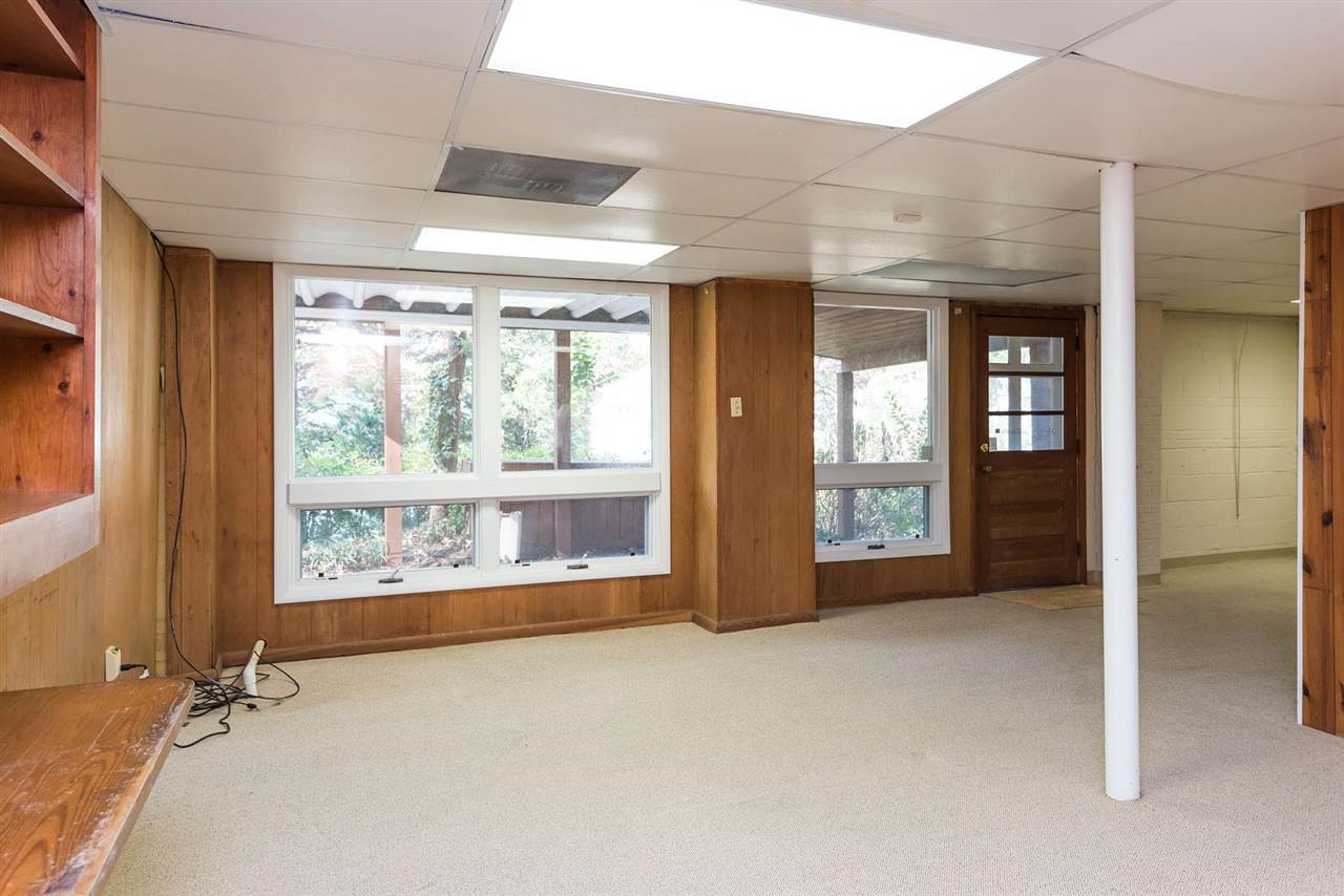 1409 Hathaway Road Raleigh, NC 27608 - Photo 17 of 25 an empty room with large windows