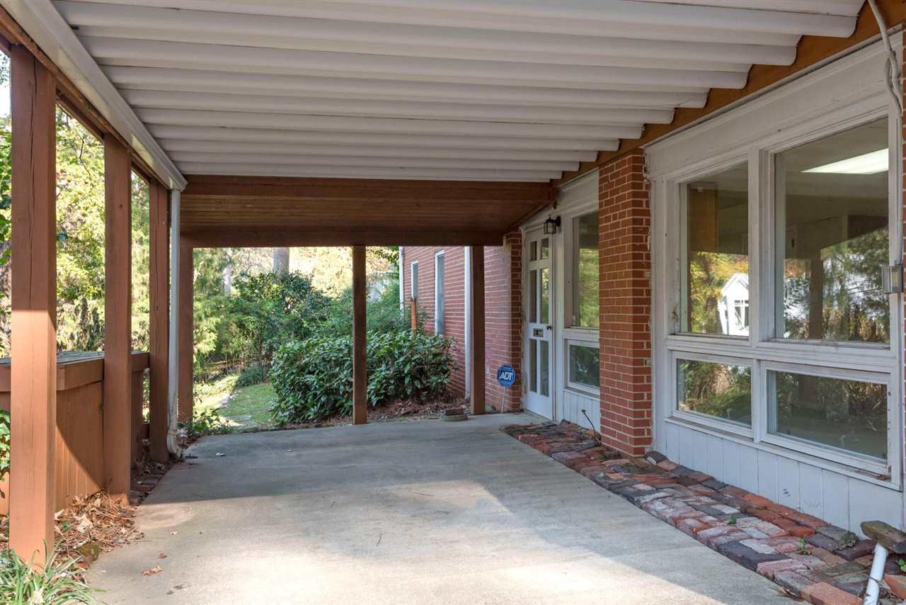 1409 Hathaway Road Raleigh, NC 27608 - Photo 19 of 25 a porch with seating space