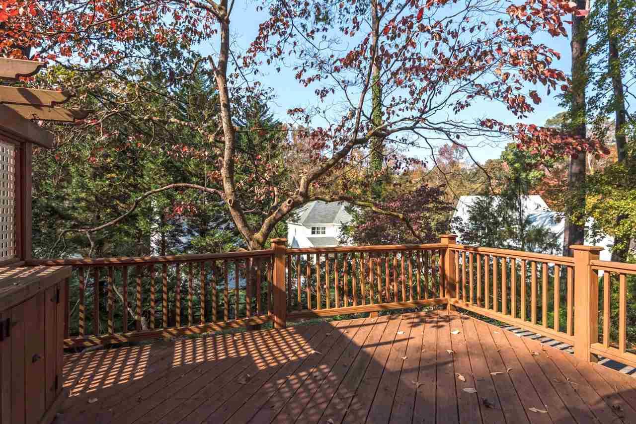 1409 Hathaway Road Raleigh, NC 27608 - Photo 22 of 25 a view of a wooden roof deck