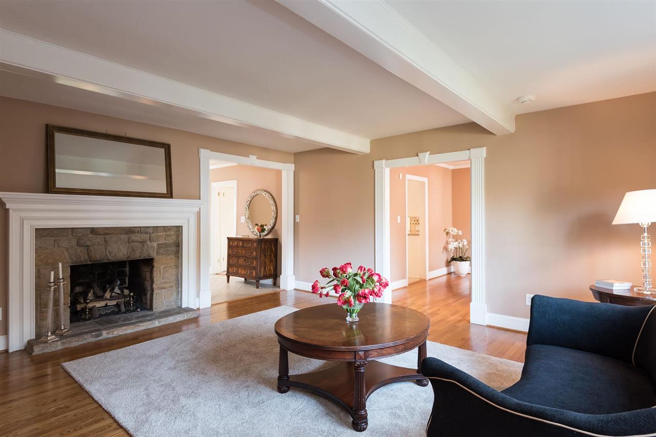 1409 Hathaway Road Raleigh, NC 27608 - Photo 7 of 25 a living room with furniture and a fireplace