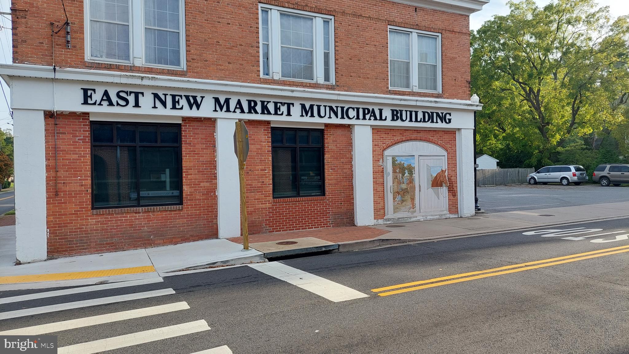 Michaels Way, Unit 1C East New Market, MD 21631 - Photo 11 of 12 a view of a building with car parked
