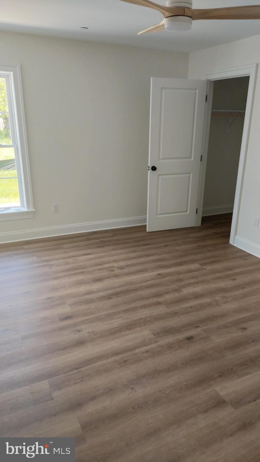 Michaels Way, Unit 1C East New Market, MD 21631 - Photo 3 of 12 a view of a room with wooden floor