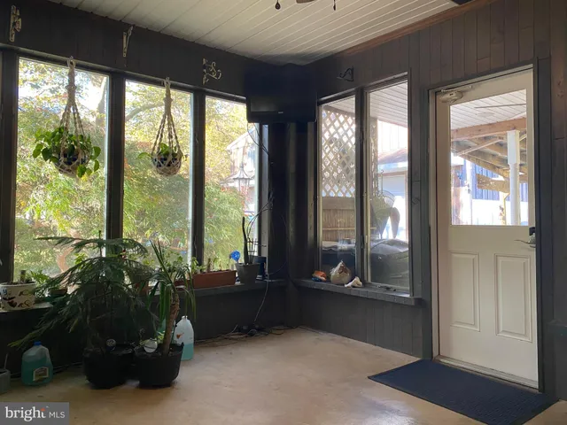 a room with a table and chairs