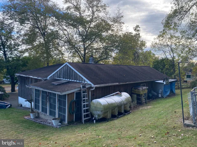 a view of garage with cars