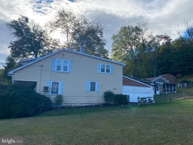a building outdoor space with patio furniture and potted plants