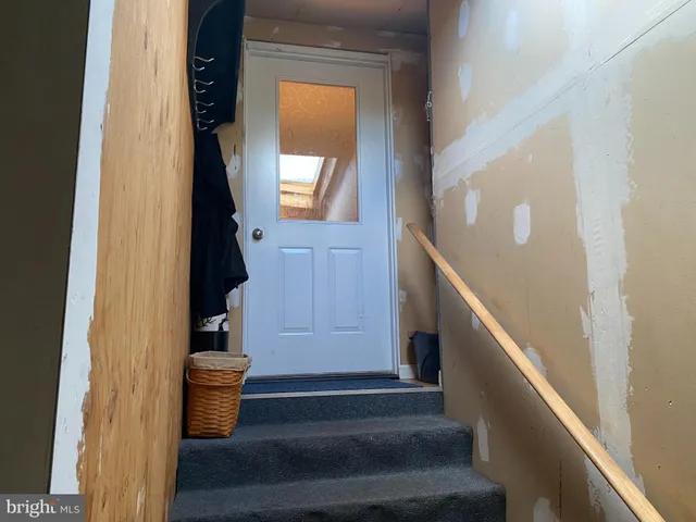 a kitchen with a table chairs and a fireplace