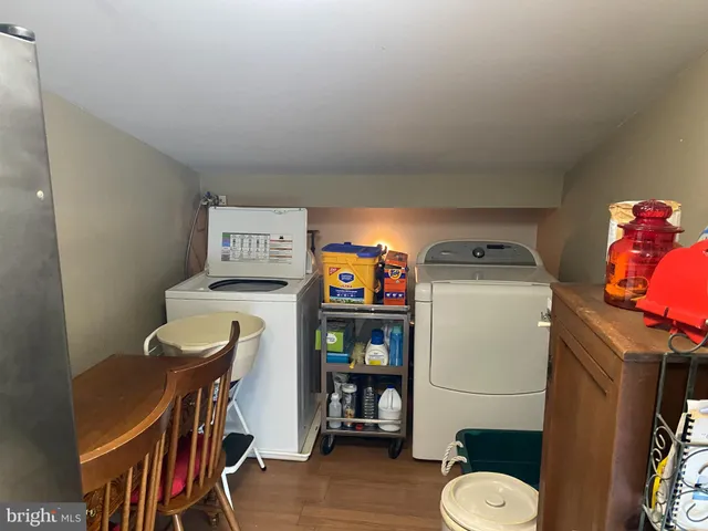 a bedroom with a bed and dresser