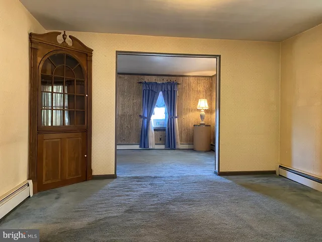 a kitchen with a sink a counter space cabinets and stainless steel appliances