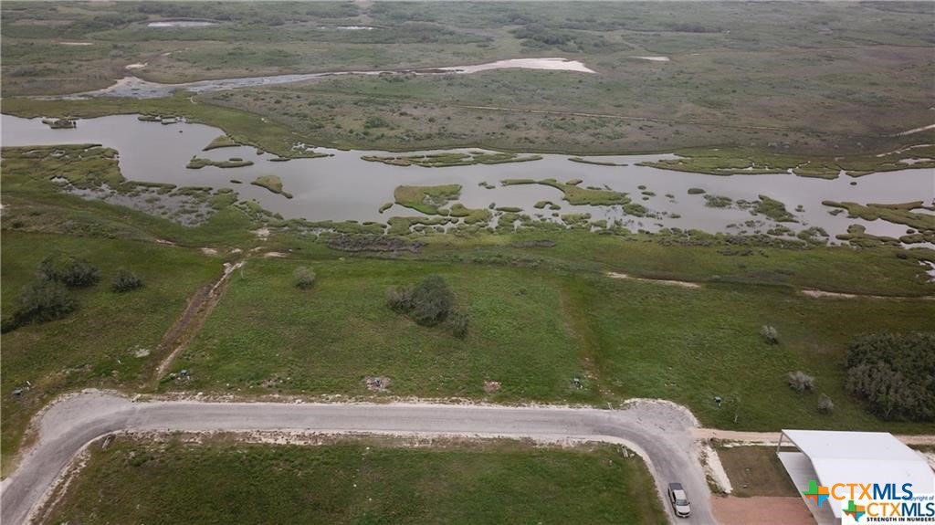 Lot 15 Easy Port Port O'Connor, TX 77982 - Photo 2 of 6 a view of a lake from a yard