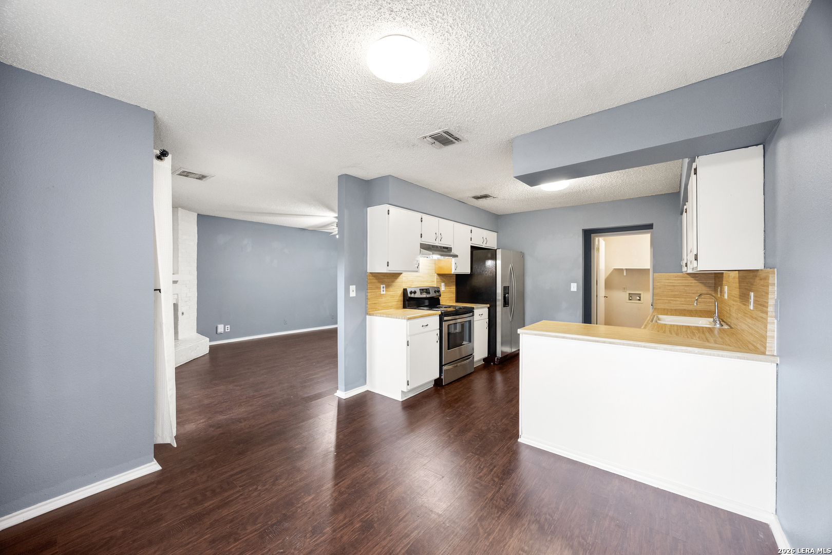 9334 Dover Ridge San Antonio, TX 78250 - Photo 12 of 42 a view of kitchen with sink and refrigerator