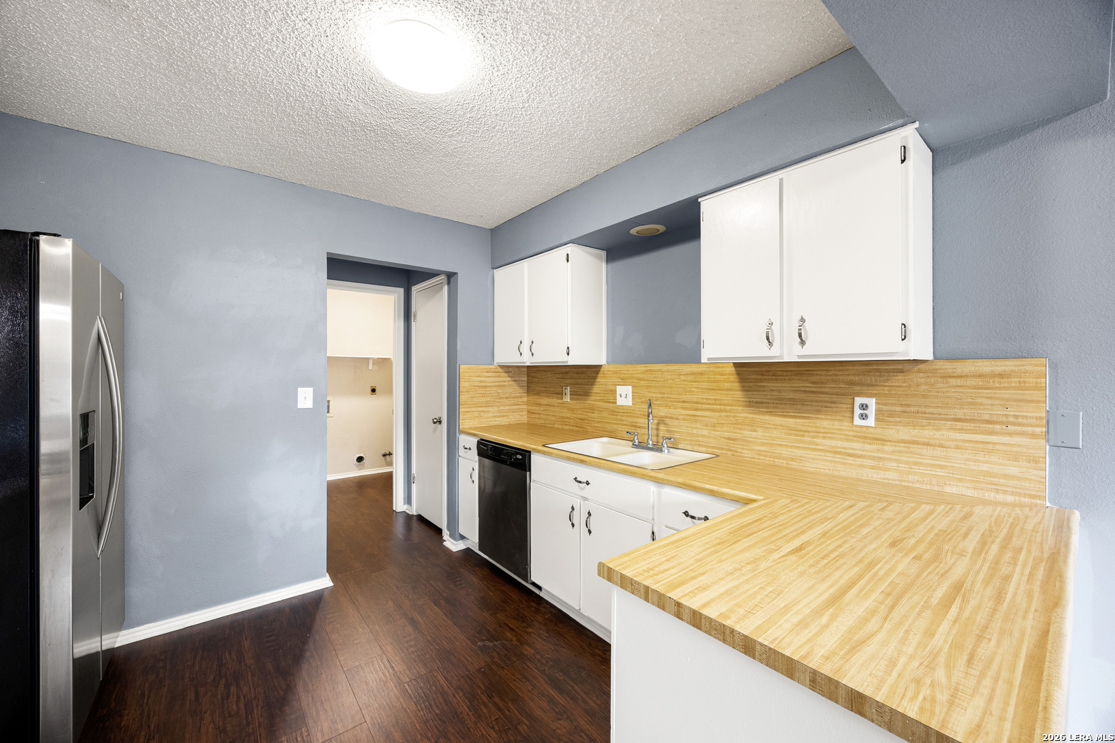 9334 Dover Ridge San Antonio, TX 78250 - Photo 14 of 42 a view of a kitchen with wooden floor
