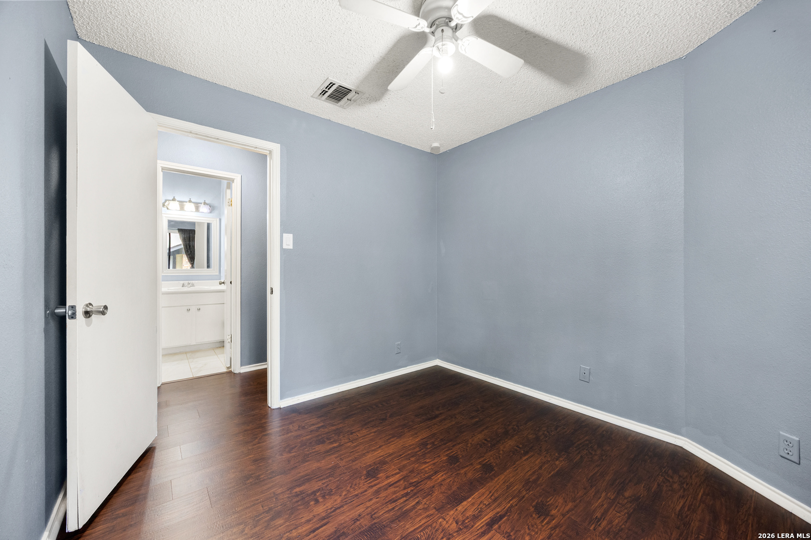 9334 Dover Ridge San Antonio, TX 78250 - Photo 19 of 42 a view of an empty room with wooden floor