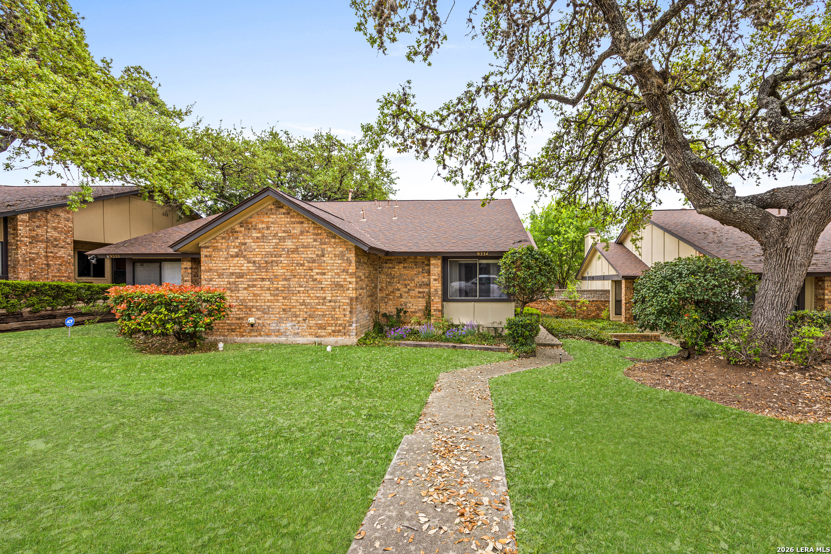9334 Dover Ridge San Antonio, TX 78250 - Photo 2 of 42 a front view of a house with a yard