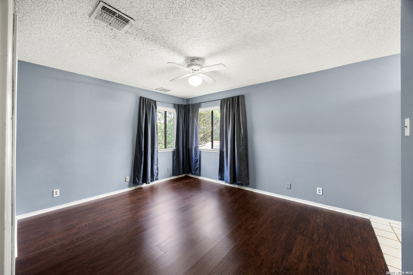 9334 Dover Ridge San Antonio, TX 78250 - Photo 21 of 42 a view of an empty room with window and wooden floor