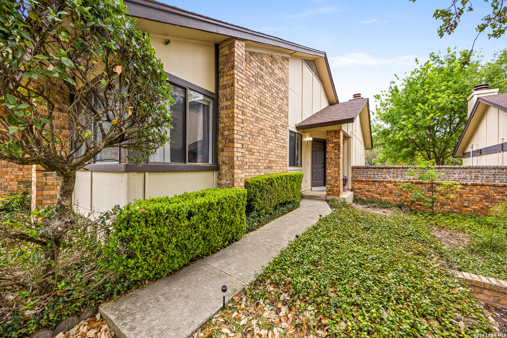 9334 Dover Ridge San Antonio, TX 78250 - Photo 4 of 42 front view of a house with a yard