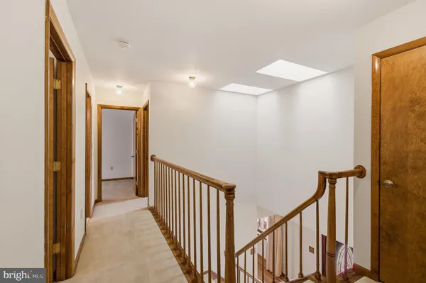 a view of an empty room with racks on the wall