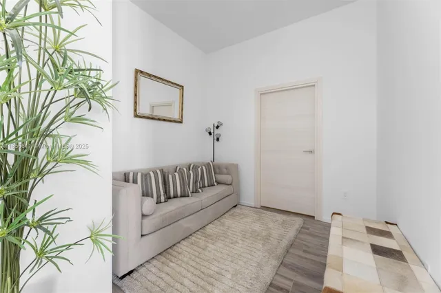 a bedroom with a large bed and a large window