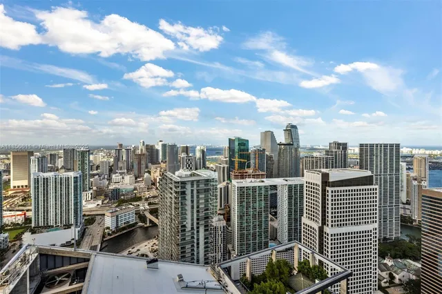 a room with lots of furniture and windows