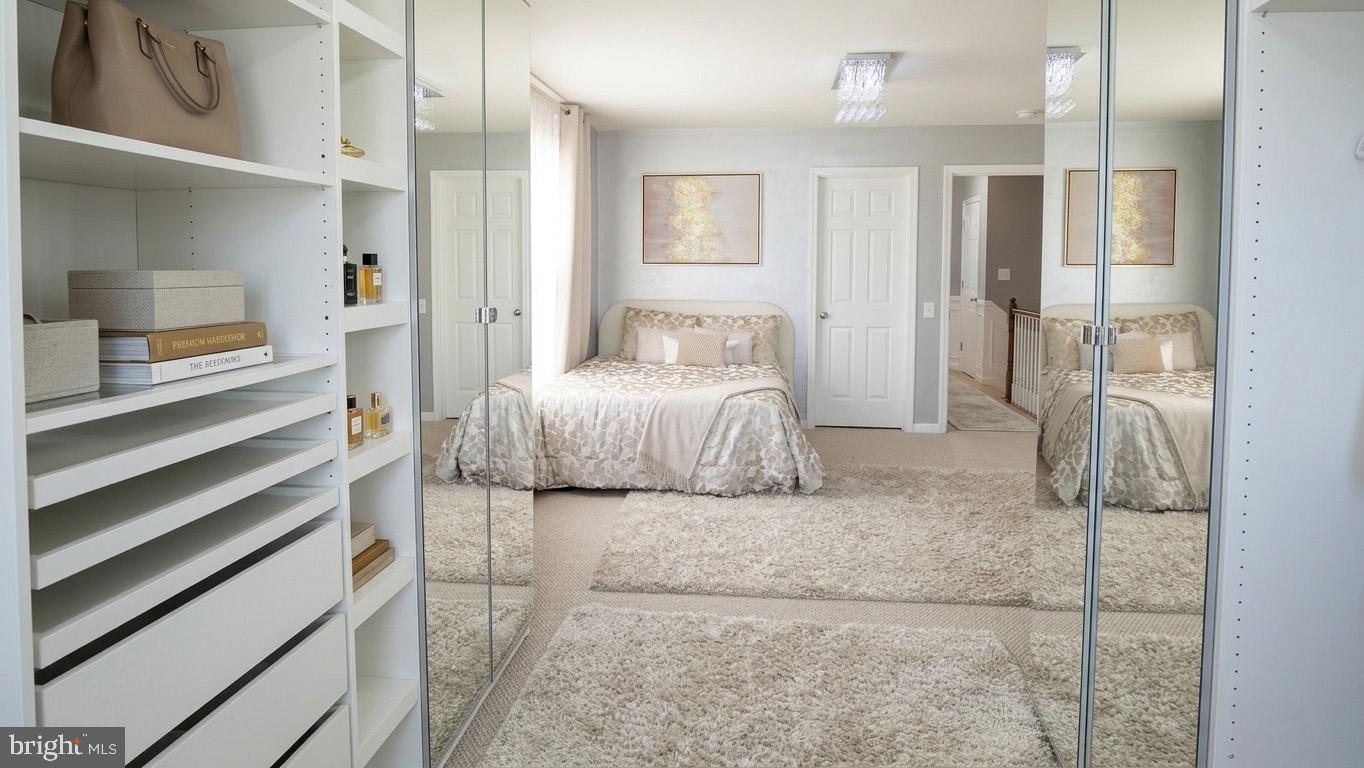 17143 Gibson Mill Road Dumfries, VA 22026 - Photo 9 of 35 Serene bedroom with mirrored elegance.