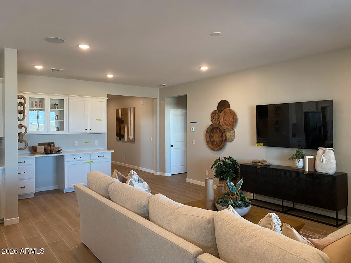 17547 West Fulton Street Goodyear, AZ 85338 - Photo 5 of 10 a living room with furniture and a flat screen tv