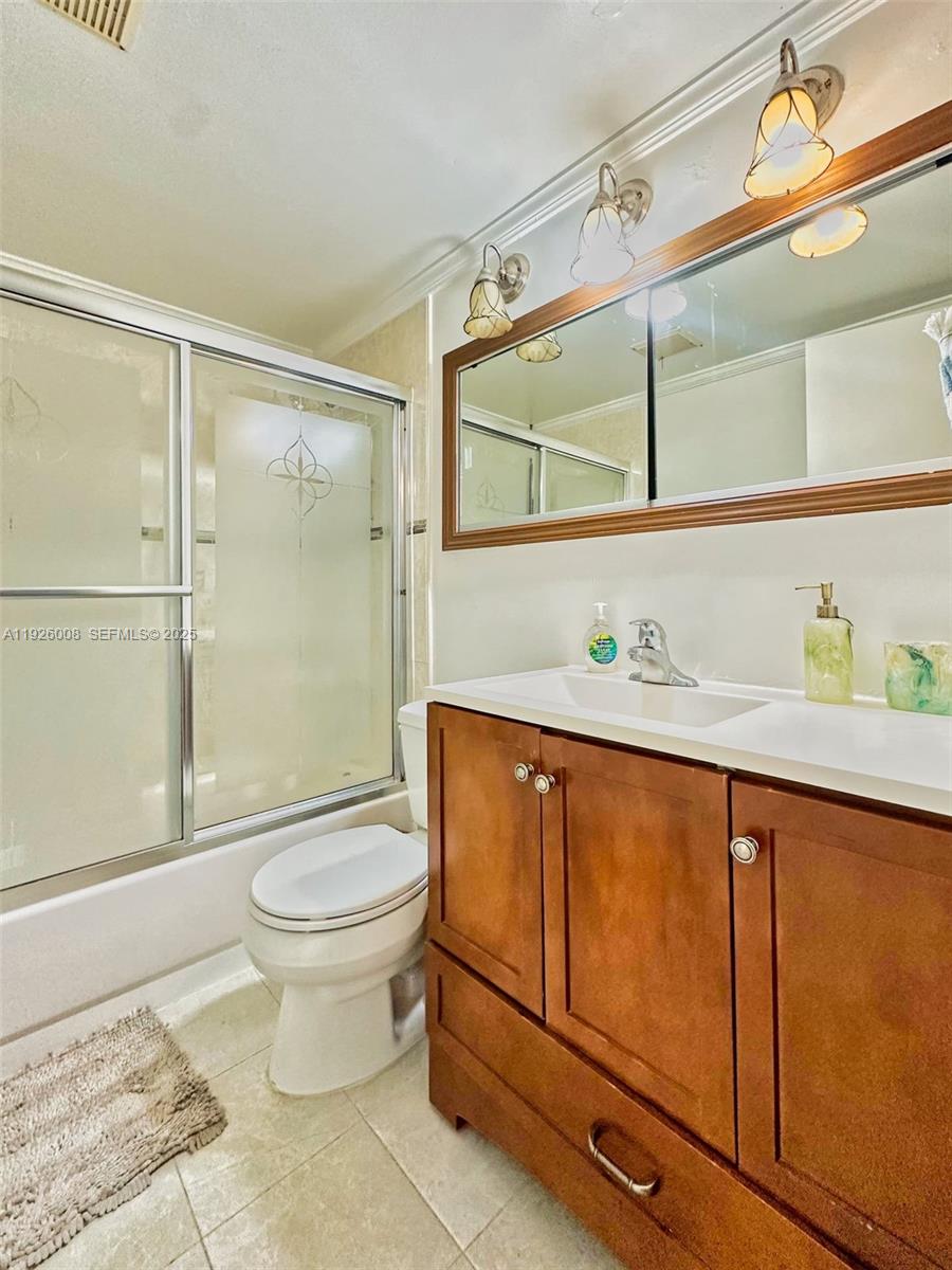 150 Southwest 134th Way, Unit 203R Pembroke Pines, FL 33027 - Photo 11 of 30 a bathroom with a granite countertop sink toilet and shower