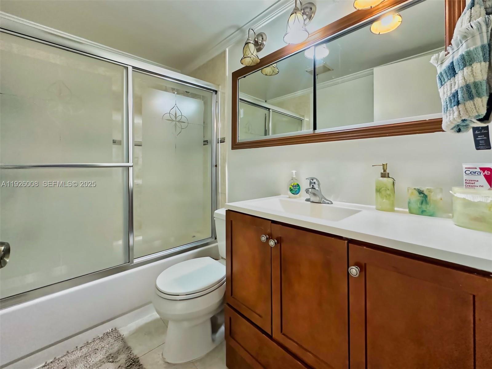 150 Southwest 134th Way, Unit 203R Pembroke Pines, FL 33027 - Photo 16 of 30 a bathroom with a sink a toilet and shower