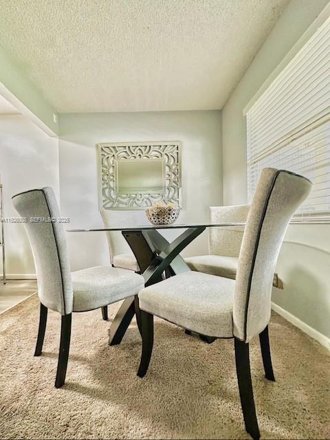 150 Southwest 134th Way, Unit 203R Pembroke Pines, FL 33027 - Photo 22 of 30 a living room with chairs and a table