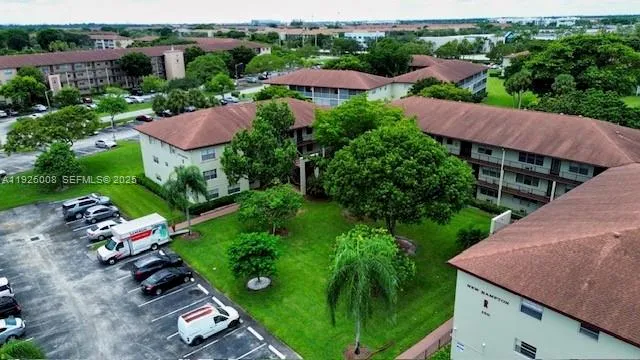 an aerial view of house with yard