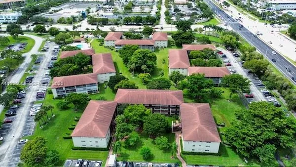an aerial view of a house with a garden